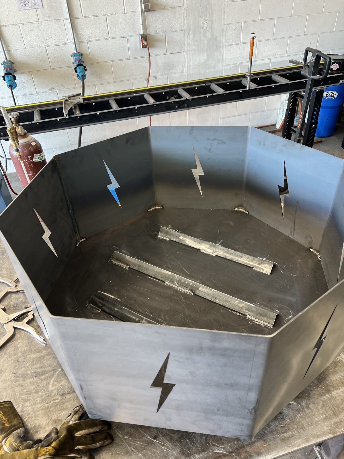 Custom octagonal fire pit with lightning bolt cutouts